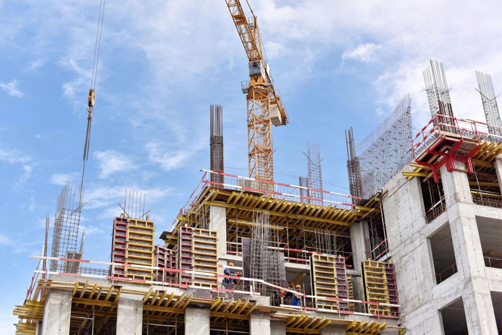 A crane is working on a construction site.